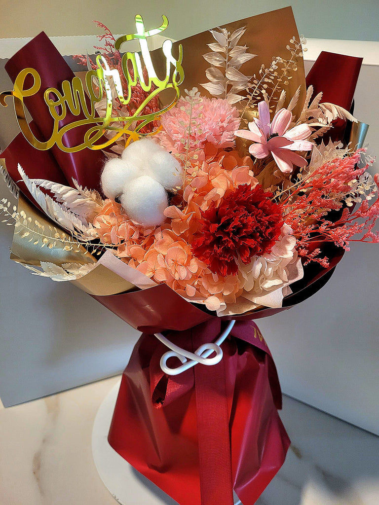 Congrats! Eternal Blossoms Preserved Red Carnation Bouquet.