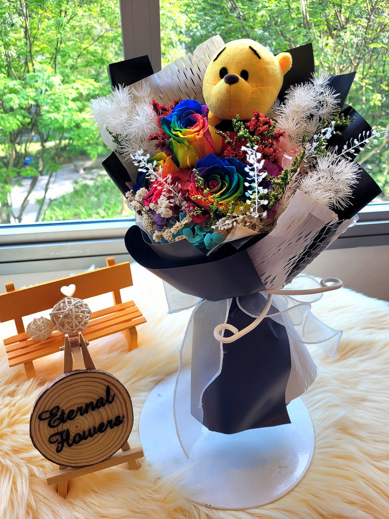 Rainbow Preserved Roses Bouquet With Winnie The Pooh Plush Toy. 100% High Quality Real Flowers. Same Day Delivery.