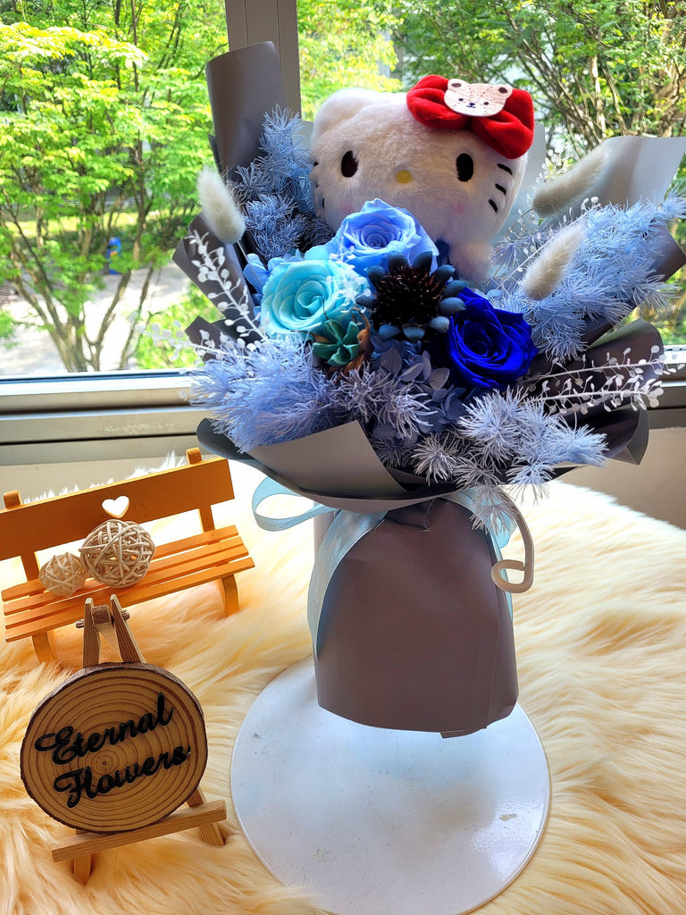 Eternal Elegance Blue Preserved Roses Bouquet With Hello Kitty Plush Toy. Same Day Delivery.