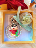 Green Rose Preserved Flower Charm With Crayon Shin-Chan. Same Day Delivery Available.