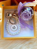 Christian Bag Charm With Purple Preserved Rose (Same Day Delivery. Comes with a Gift Box)