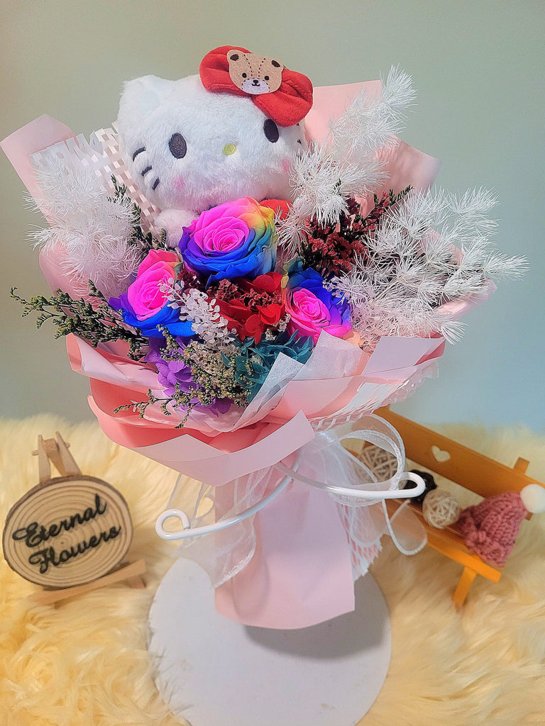 Rainbow Preserved Roses Bouquet With Elegant Pink Wrapper and Hello Kitty Plush Toy. Same Day Delivery.