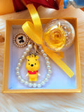 Yellow Rose Preserved Flower Charm With Winnie The Pooh. Same Day Delivery Available.